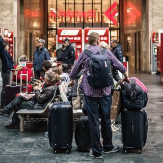man with luggage Shiji Insights for Hotels